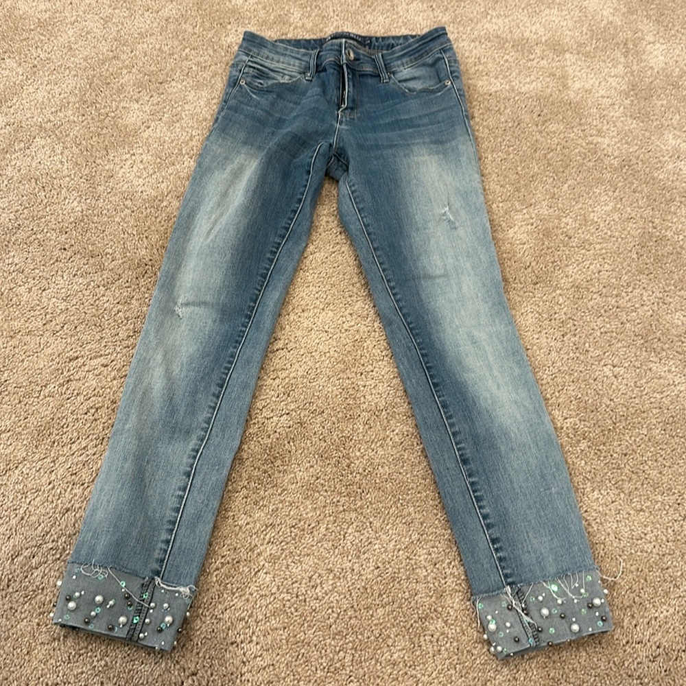 Light wash straight leg jeans with pearl bottom